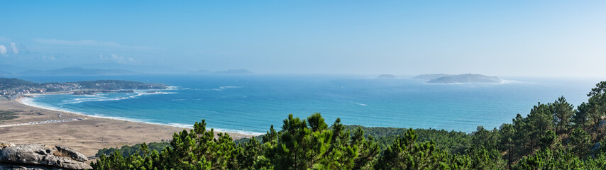 Aerial view of beaches and small villages along the Ria de Pontevedra in Spain, with the Cies...