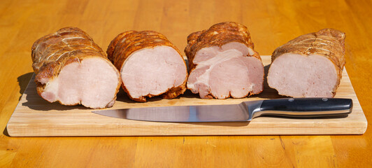 Smoked pork ham. Cold cuts on wooden board