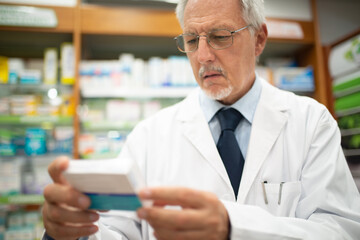 Pharmacist checking a drug