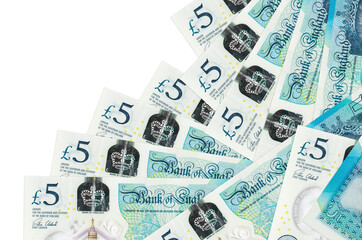 5 British pounds bills lies in different order isolated on white. Local banking or money making...