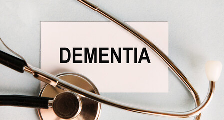 on the business card text DEMENTIA, next to the stethoscope.