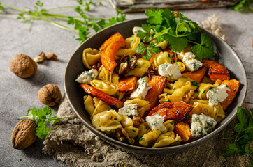 Homemade pasta with roasted pumpkin and blue cheese