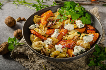 Homemade pasta with roasted pumpkin and blue cheese