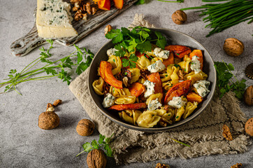 Homemade pasta with roasted pumpkin and blue cheese