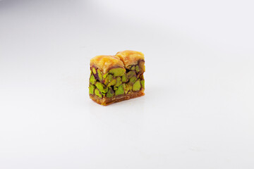Middle eastern, Turkish sweet pastry baklava with pistachio isolated on white background
