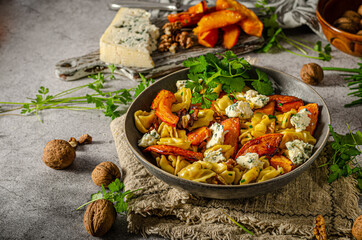 Homemade pasta with roasted pumpkin and blue cheese