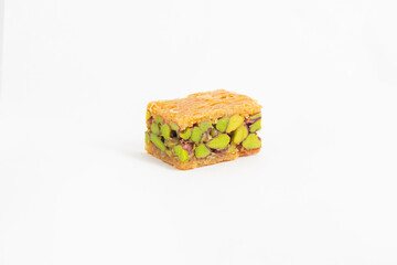 Middle eastern, Turkish sweet pastry baklava with pistachio isolated on white background
