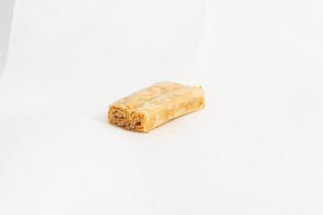 Middle eastern, Turkish sweet pastry baklava with pistachio isolated on white background
