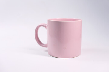 Close up of pink color coffee mug on white background 