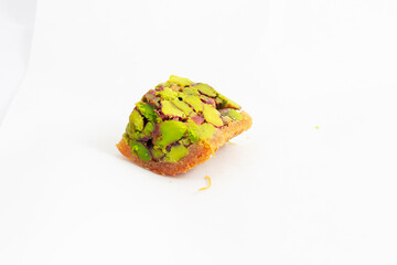 Middle eastern, Mabroumeh or Turkish sweet pastry baklava isolated on white background
