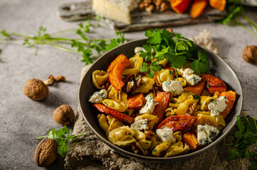 Homemade pasta with roasted pumpkin and blue cheese