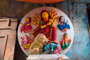 Artistic unfinished idol of Goddess Durga on a background.