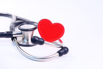 heart shape symbol and stethoscope on white background 