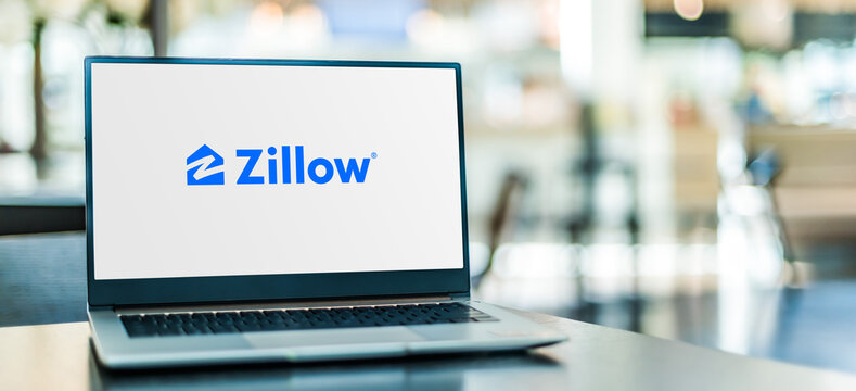 Laptop computer displaying logo of Zillow