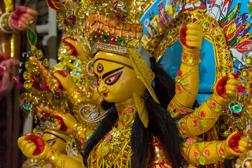 View from side of a traditional idol of Goddess Durga with use of selective focus.