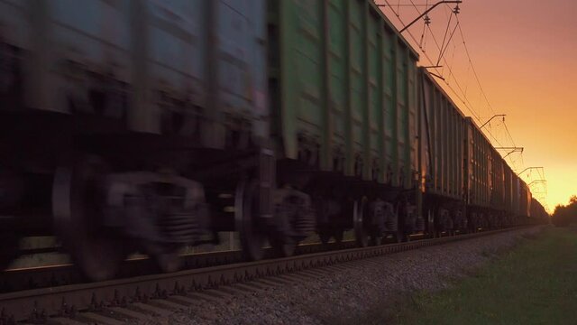 moving cargo freight container train in the evening railroad
