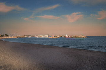 Coast Villajoiosa of Spanish town. Mediterranean City Costa Blanca in the Province of Alicante, Valencian Community Spain. Port view with yachts and vessels. Lonely lighthouse. Image with copy space.