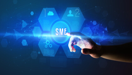 Hand touching SME inscription, new technology concept