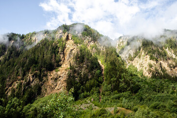 Light fog over a mountain n the Valais Alps of Switzerland on a summer day. 