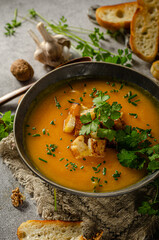 Pumpkin soup with herbs and crispy toast