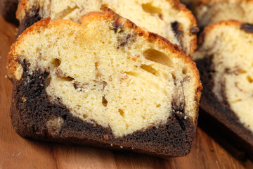 Close up of bakery cake on chopping board .