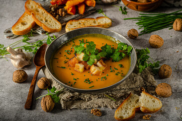 Pumpkin soup with herbs and crispy toast