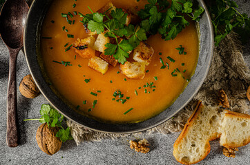 Pumpkin soup with herbs and crispy toast