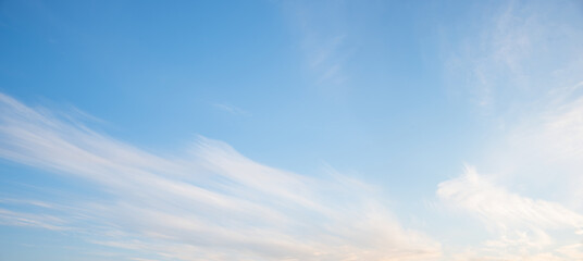 light blue sky with soft cirrus clouds and copy space - obrazy, fototapety, plakaty