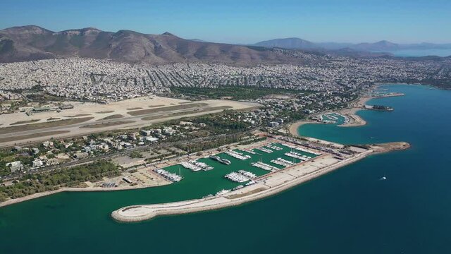 Aerial drone video of Marina of Agios Kosmas and abandoned former international airport of Athens in Elliniko area, South Athens riviera, Attica, Greece