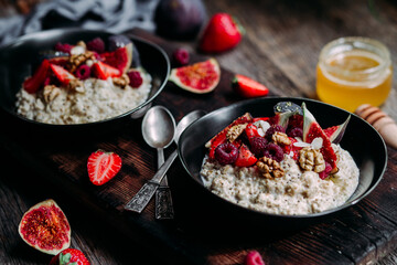 Oatmeal with figs, chia, raspberries and strawberries. Healthy Breakfast