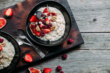 Oatmeal with figs, chia, raspberries and strawberries. Healthy Breakfast