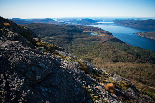 Beautiful nature view with fjord and mountains. Hiking trail vantage point. Location: Scandinavian Mountains, Norway.