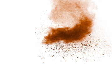 Brown dust splashing.Brown particles splattered on white background.