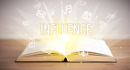 Opeen book with INFLUENCE inscription, business concept