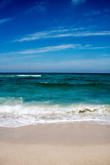 beautiful sandy beach and soft blue ocean wave
