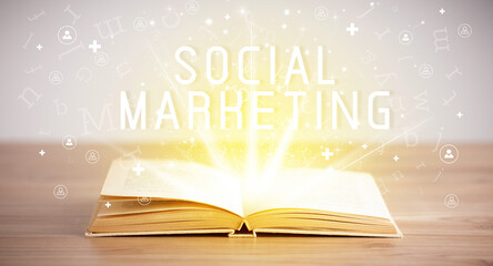 Open book with SOCIAL MARKETING inscription, social media concept