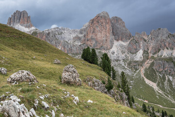 Fototapeta na wymiar Mugoni mountain group and Le Cigolade mountain with Cigolade pass in between with La Sforcela mountain on the left as seen from Roda di Vael refuge, Catinaccio massif, Dolomites, South Tyrol, Italy