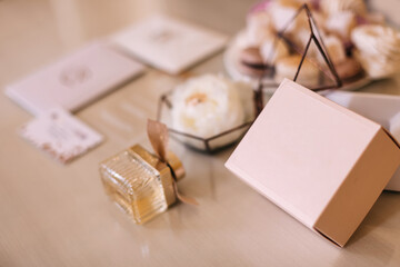 closeup of perfume packaging and bottle of perfume. wedding acce