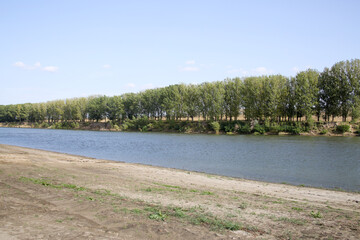 River landscape. Deserted sandy beach.