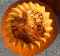 Above view of an orange zigzag carved halloween pumpkin