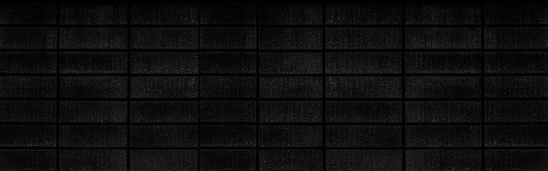 Naklejka premium Panorama of Black cement block fence seamless background and pattern