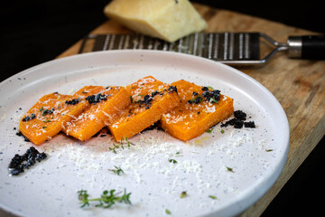 Baked pumpkin with truffle salsa and parmesan