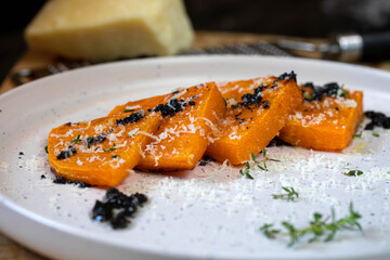 Baked pumpkin with truffle salsa and parmesan
