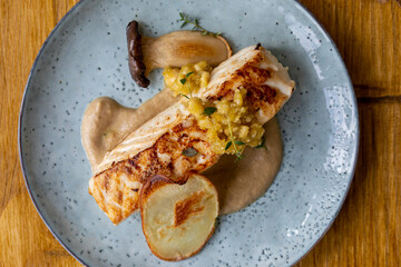 Pan fried halibut with mushroom velute, hazelnut pesto and potato crisps
