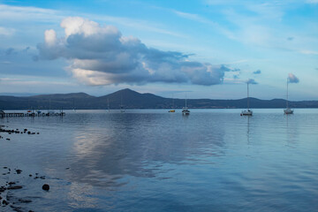 panorama of the lake of Bracciano 
blue sky with clouds reflected in the water