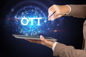 Close-up of a touchscreen with OTT abbreviation, modern technology concept
