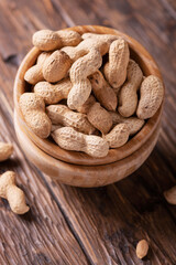  Roasted peanuts in wooden bowl