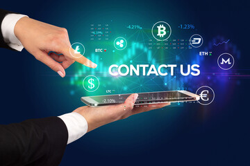 Close-up of a touchscreen with CONTACT US inscription, business opportunity concept