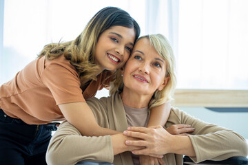 mixed race happy family lifestyle, adopting caucasian mother and Asian daughter hugging with smile....