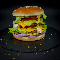 Big burger on the black stone tray 
